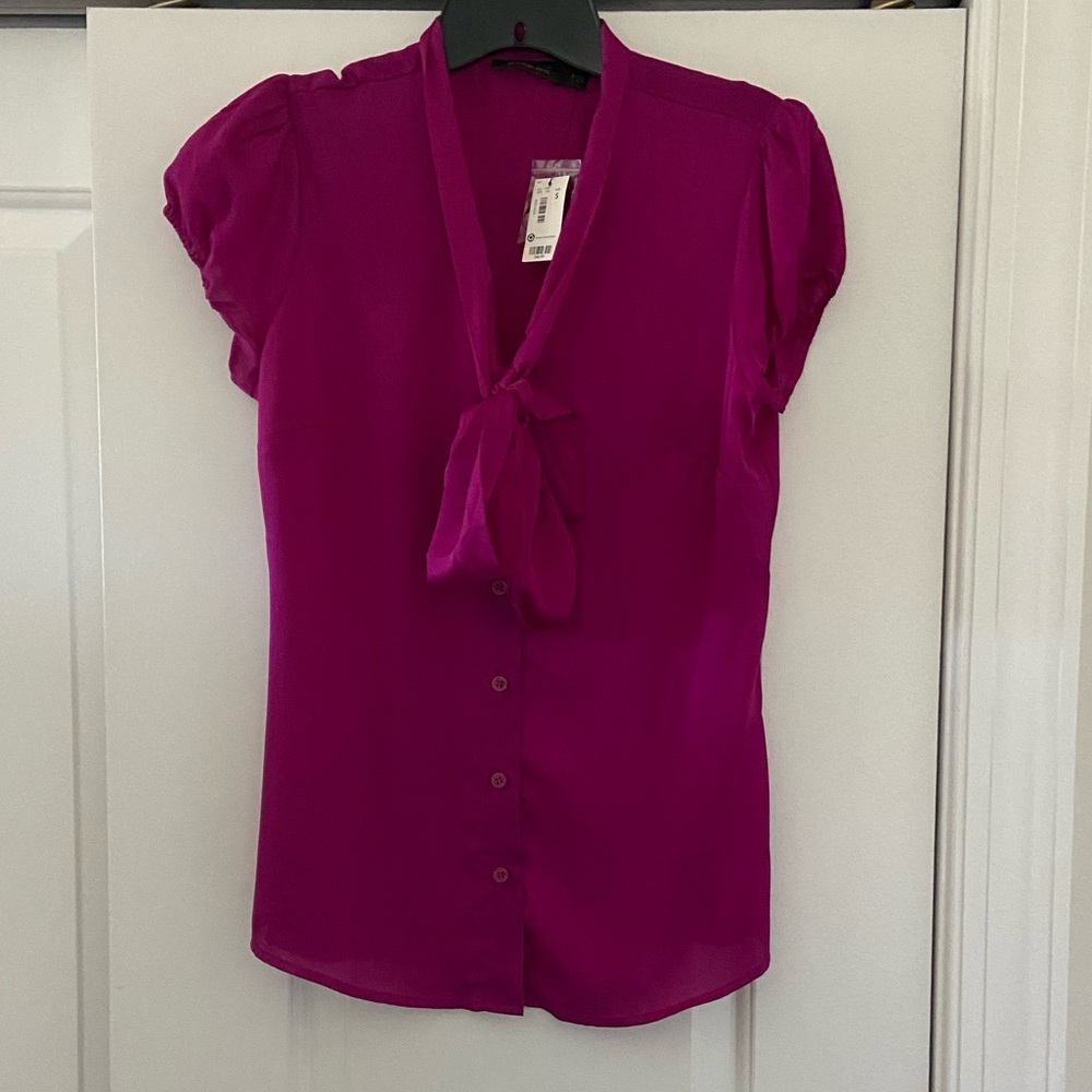 The limited women’s magenta pink satin tie blouse
